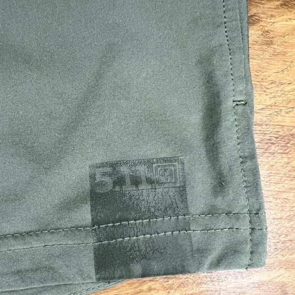 5.11 tactical shorts. Olive green and black waist is 13.25” - Picture 3 of 5